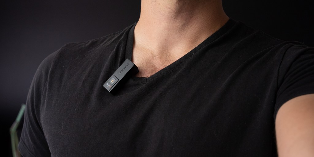 Comica VDLive10 transmitter clipped to a shirt