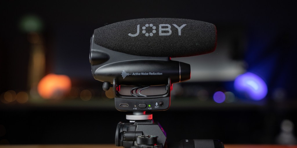 The Joby Wavo PRO sits atop a Sony camera.